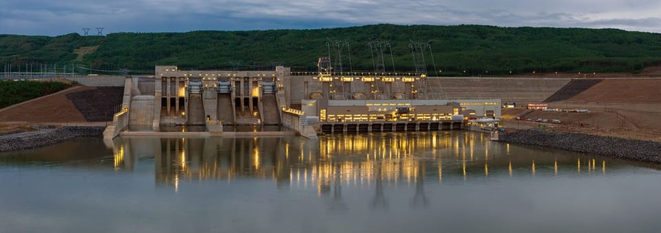 A British Columbia hydroelectric generating station lit at dusk
